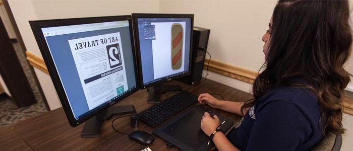 image of student working designing on a computer